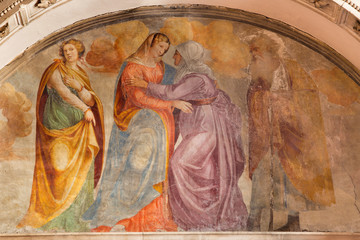 BRESCIA, ITALY - MAY 22, 2016: The fresco of The Visitation in church Chiesa di San Francesco d Assisi by Francesco Prata da Caravaggio (1520).