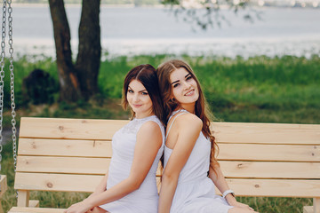 Naklejka premium two girls resting on the beach