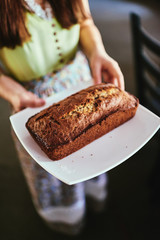 Woman baking bread. The kitchen fills with wonderful smells of fresh baking.