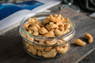 Cashew nuts, Walnuts and almonds with whiskey on wooden backgrou