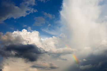 Fototapeta na wymiar blue sky and cloud with rainbow
