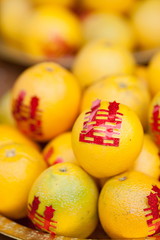 Chinese orange in gold basket for wedding ceremony