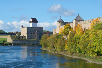 Naklejka na ściany i meble View of the Ivangorod fortress and the castle of Herman sunny September day. The border of Russia and Estonia