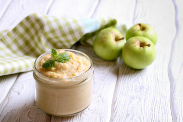 apple puree in glass jar, horizontal, close up