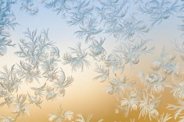 Frosty patterns on glass. Winter background.