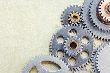 different gears as details of machines on metal background