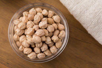 Garbanzo beans or chickpeas in a glass bowl with copy space.