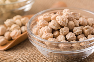 Garbanzo beans or chickpeas in a glass bowl with copy space.