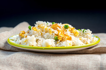 Homemade Chinese fried rice with vegetables and fried eggs