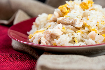 Homemade Chinese fried rice with vegetables and fried eggs