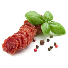 Salami smoked sausage slices, basil leaves and peppercorns isola