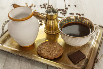 Vintage tray with coffee, milk, chocolate and cookies