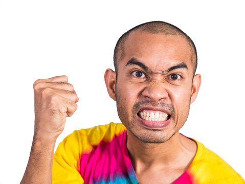 Asian man clench his hand with angry face isolated on white