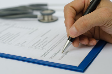 Doctor writing document.