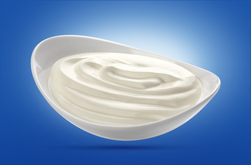 Sour cream in white bowl isolated