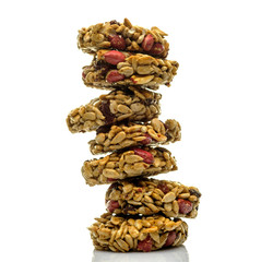 Kozinaki, briquettes of sunflower seeds, candied sugar, caramel or honey isolated on white background.