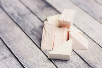 pink marshmallow on a wooden background