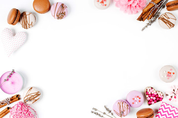 Holiday frame. Cake macaroon, hearts and romantic accessories with copy space.White  background