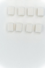Cubes of white sugar on the table