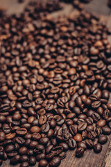 scattered coffee beans wooden table