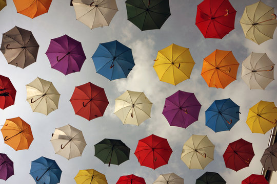 Colorful umbrellas background. Colorful umbrellas in the sky. Street decoration.