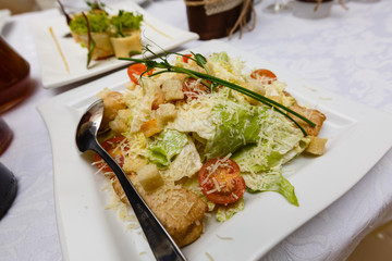 Restaurant healthy food, diet nutrition - fresh salad with salmon, quail eggs, cherry tomatoes and lettuce, closeup