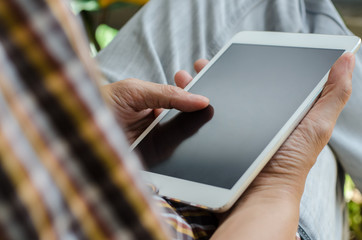 Man using digital tablet.