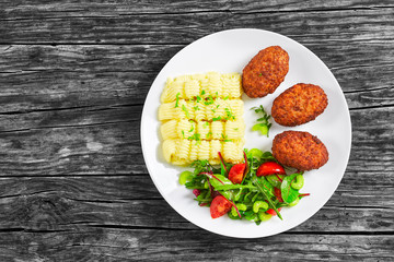 delicious mashed potatoes with juicy meat cutlets