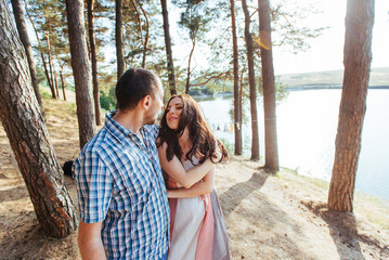 Loving couple on the beach near the water