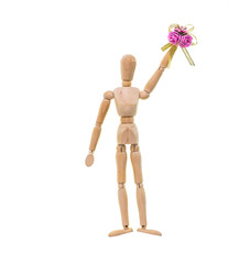 Wooden figure of man with flowers on a white background isolated