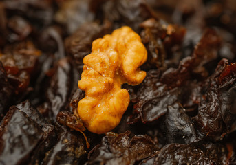walnut on a dried plums