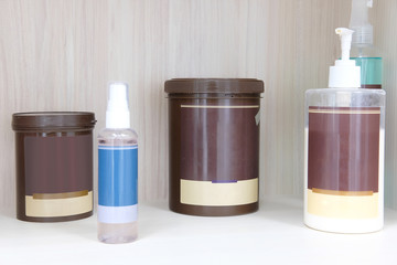 The bottles with shampoo and other perfume