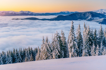 fog in winter mountains. Fantastic sunset