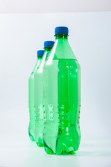 green plastic bottle on a white background