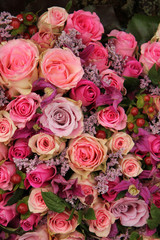 purple and pink roses wedding arrangement
