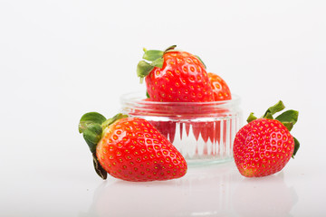 Bright red strawberries against a white background