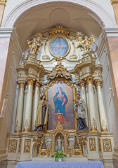 Fototapeta na wymiar TRNAVA, SLOVAKIA - MARCH 3, 2014: The side baroque altar in Jesuits church from 18. cent.
