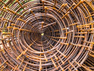 Roll of rusty iron cage for concrete reinforcing. Reinforcing ba