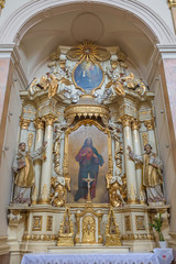 Fototapeta na wymiar TRNAVA, SLOVAKIA - MARCH 3, 2014: The side baroque altar in Jesuits church from 18. cent.