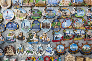 Souvenir magnets for sale on a souvenir and arts market.