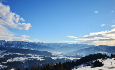 Fototapeta na wymiar View of the Allgaeu Alps (Allgäu Alps) covered in snow, as seen from Sulzberg, Vorarlberg, Austria