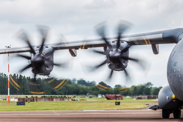 Prop blur of the A400M as it taxis off the runway at RIAT - obrazy, fototapety, plakaty