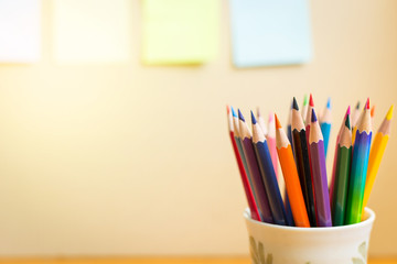Colour pencils with  notepads on clear background