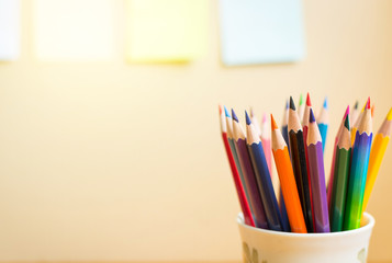 Colour pencils with  notepads on clear background