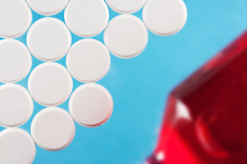 Modern white medical pills on medical background