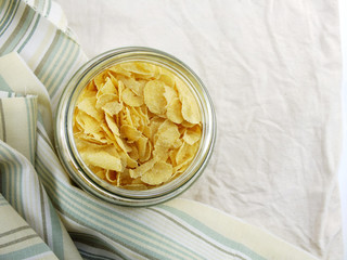 top view closeup of cornflakes in grasses bottle