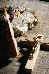 Holy Christian cross and bread like a concept for Catholic and Christian religion 