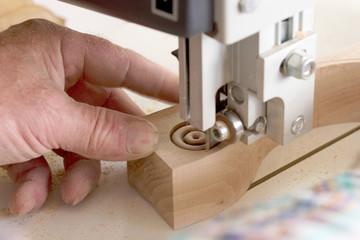 Carpenter tools on wooden table with sawdust. Band-saw to cut an