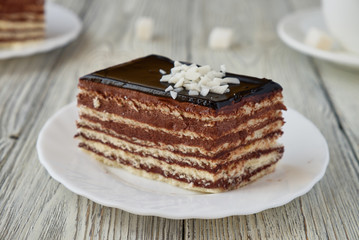 Delicious dessert cake with chocolate cream and coffee