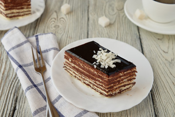Delicious dessert cake with chocolate cream and coffee